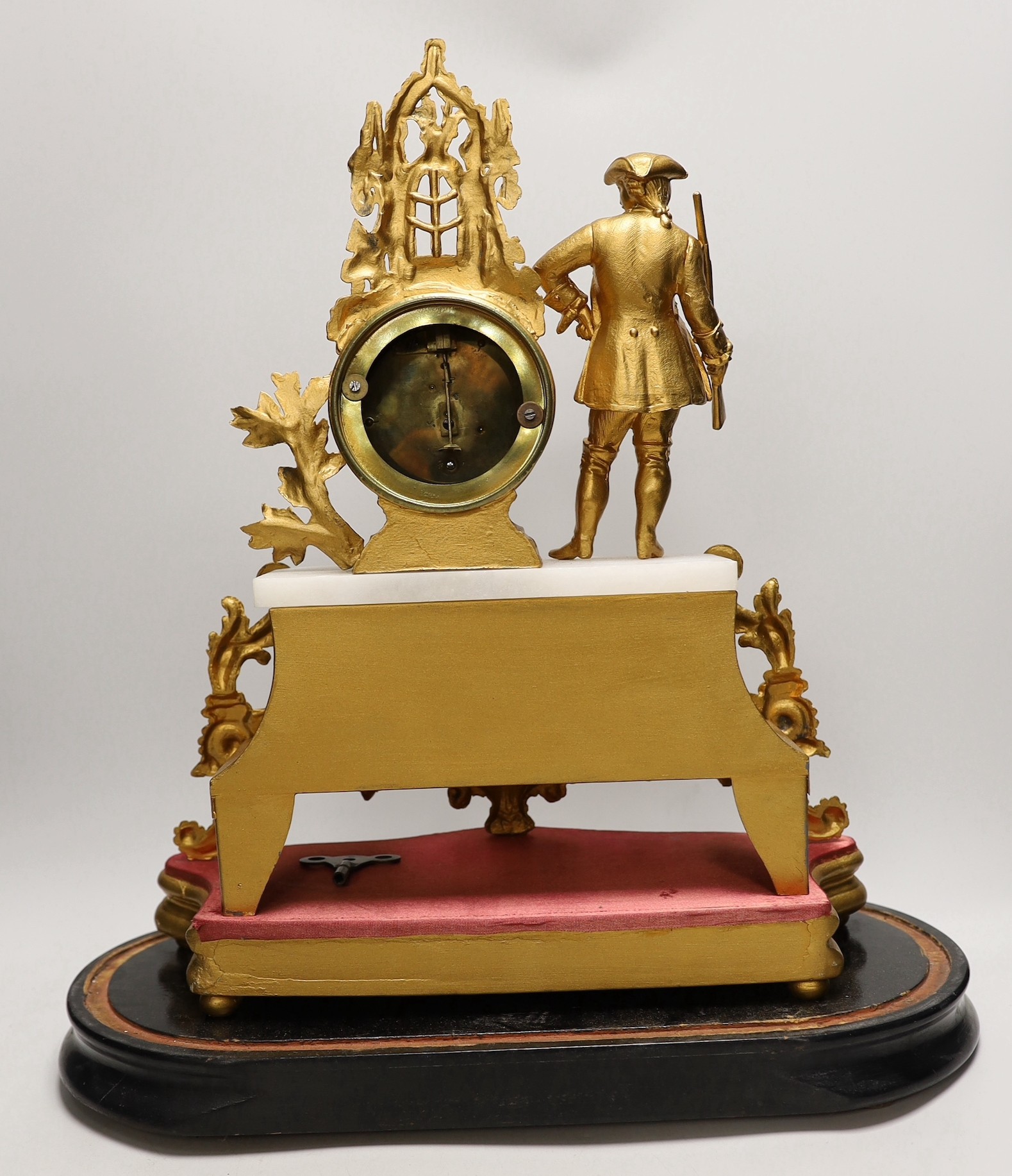 A French gilt metal mantel clock under dome. Overall 53cm tall